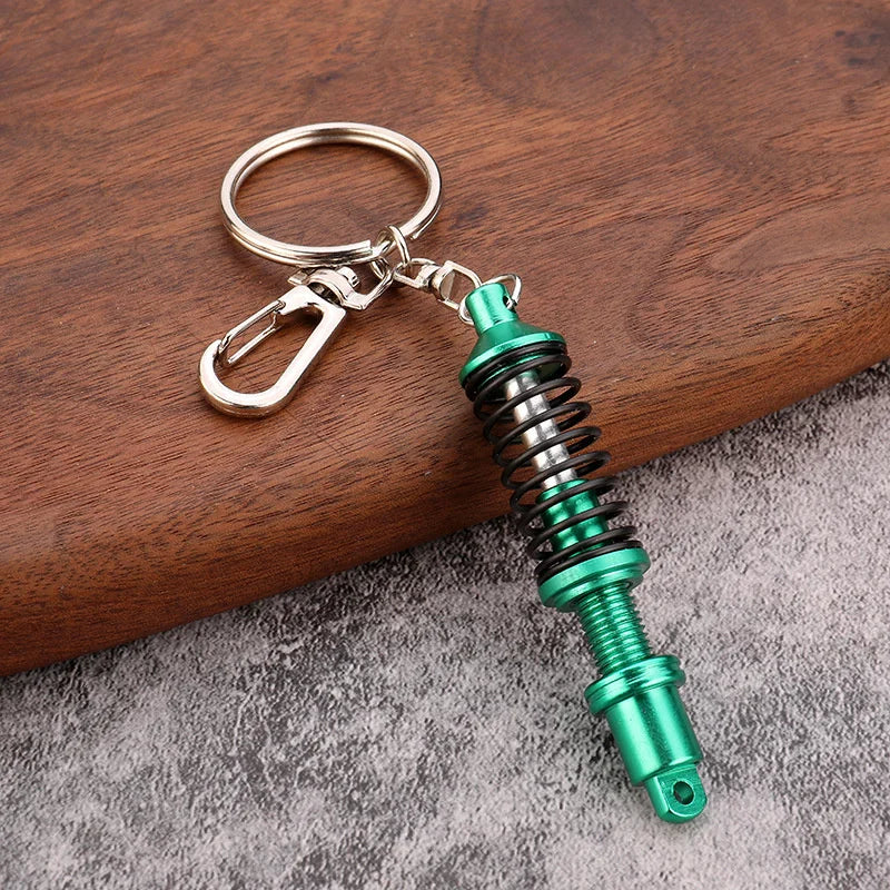 🚗 Mini Shock Absorber Keychain – Functional Suspension Style!
