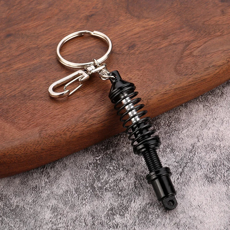 🚗 Mini Shock Absorber Keychain – Functional Suspension Style!