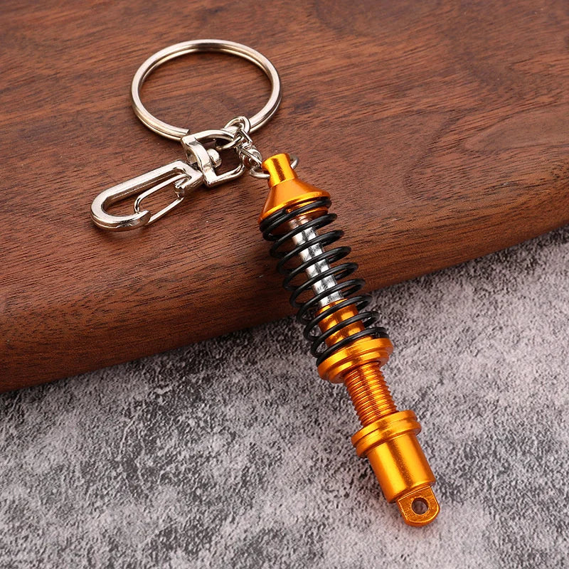 🚗 Mini Shock Absorber Keychain – Functional Suspension Style!