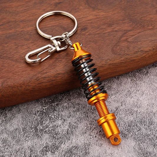 🚗 Mini Shock Absorber Keychain – Functional Suspension Style!