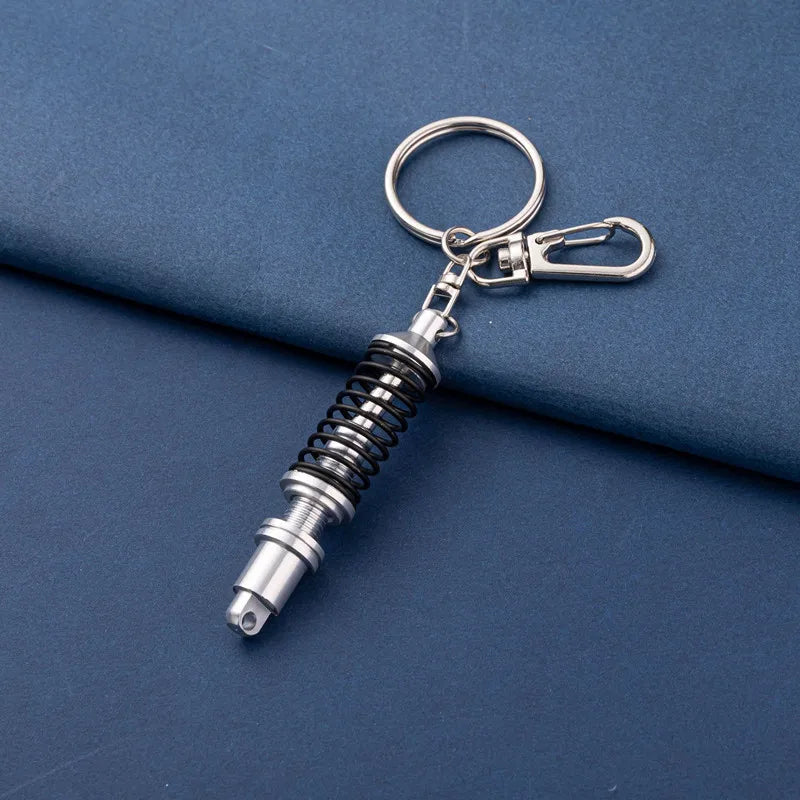 🚗 Mini Shock Absorber Keychain – Functional Suspension Style!