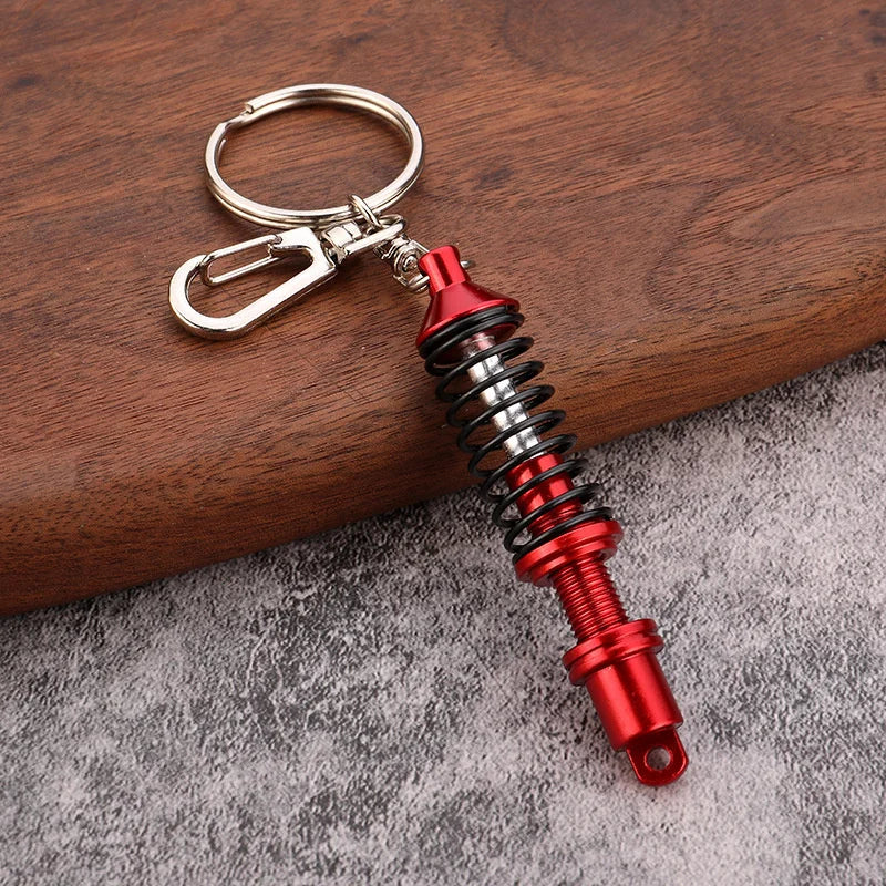 🚗 Mini Shock Absorber Keychain – Functional Suspension Style!