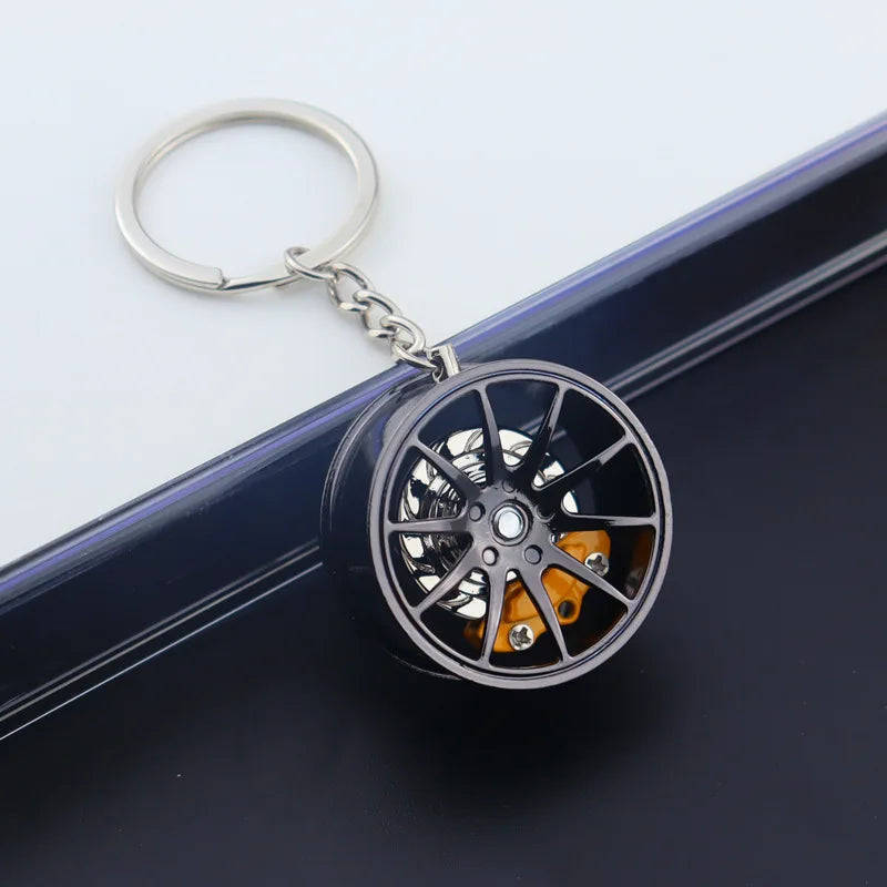 🟡 Racing Tire Hub Keychain – Stylish Metal Pendant for Car Enthusiasts