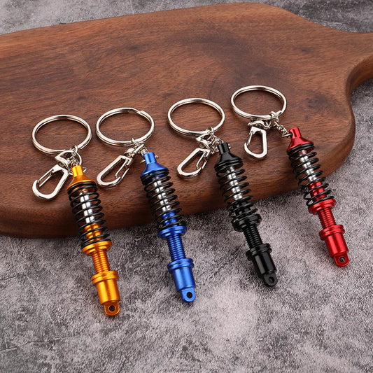 🚗 Mini Shock Absorber Keychain – Functional Suspension Style!