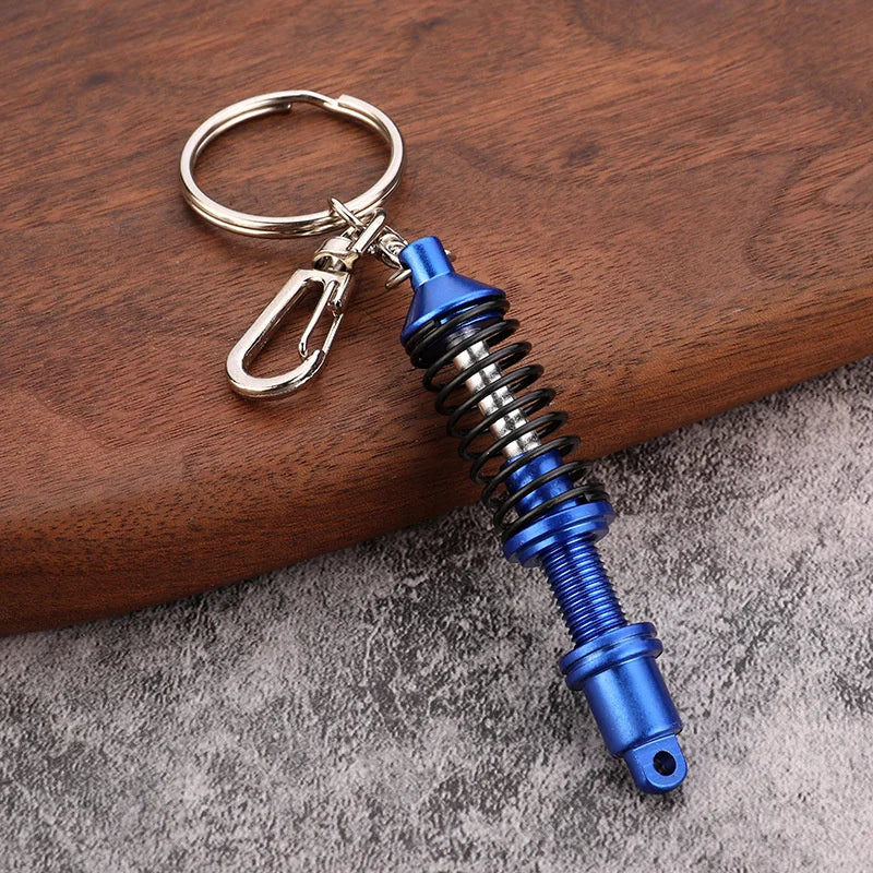 🚗 Mini Shock Absorber Keychain – Functional Suspension Style!